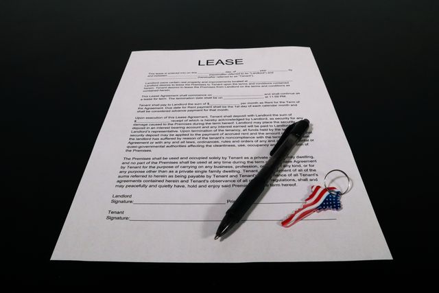 lease agreement with a pen and house key