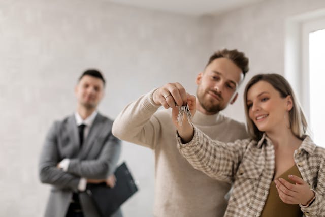 Happy couple holding a key